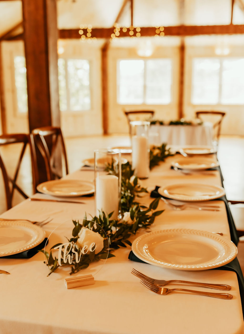Candlelit barn wedding dinner at The 1812 Farm
